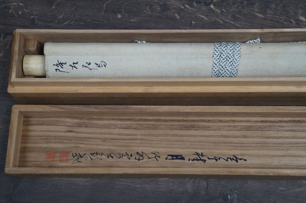 Opened storage box with rolled-up Kakemono Heron in Quiet Peony Splendor