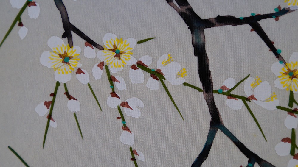 Close-up of the white and yellow plum blossoms on the branch in the hanging scroll Heralds of Spring by Koizumi Kogetsu
