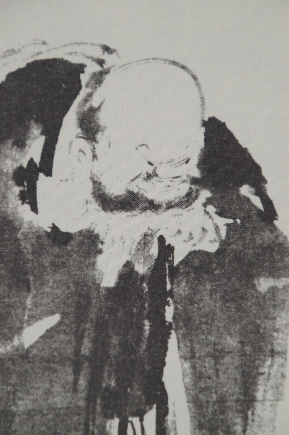 Extreme close-up of Hotei's smiling face in the Hotei scroll of the triptych after Miyamoto Musashi