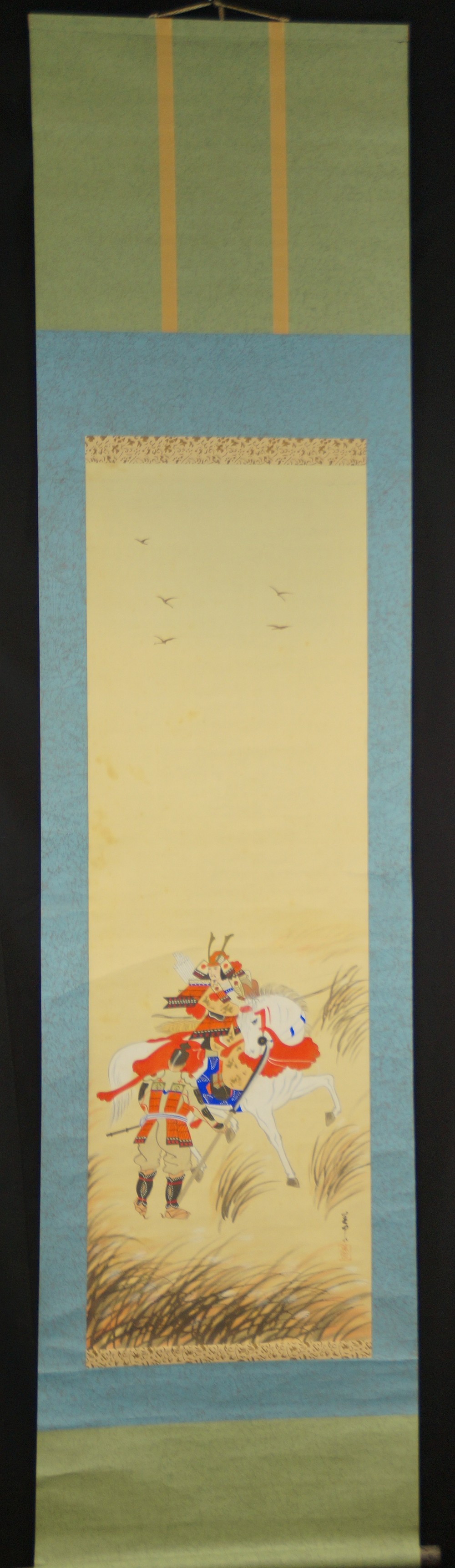 Overall view of the hanging scroll with mounted samurai in autumn grass