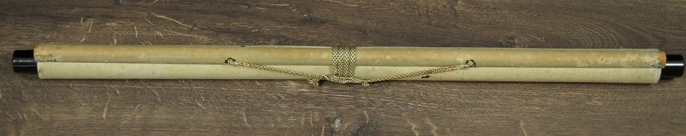 The rolled-up kakemono tied with cord