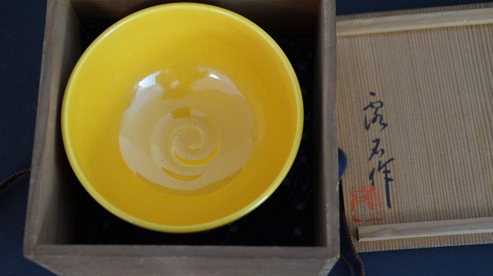 Chawan made of Kyoto ware in the open storage box next to the signed box lid