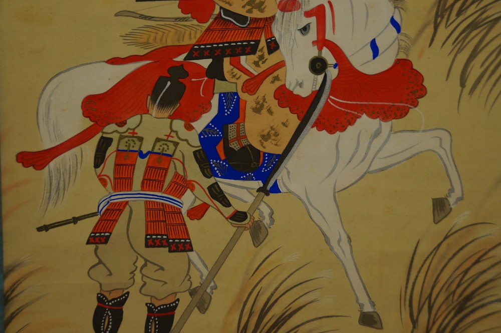 Close-up of the white horse with red saddle ornament and the armor of the retainer