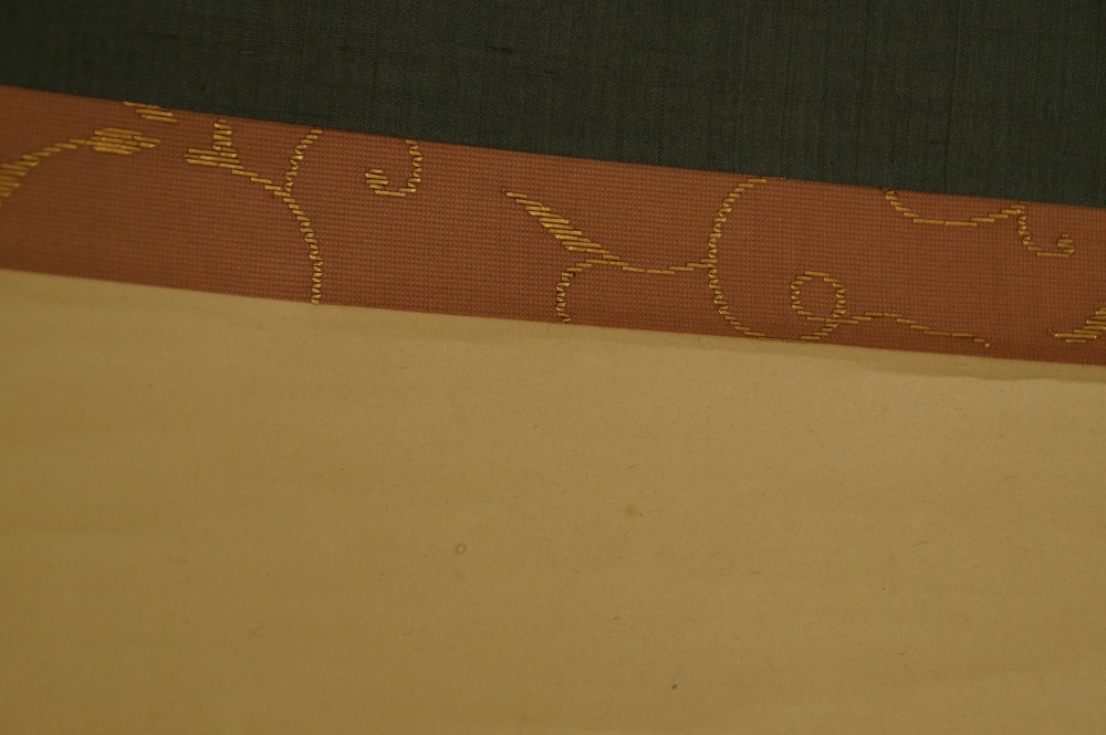 Close-Up of the Gold-Patterned Border Between Green Frame and Image Support