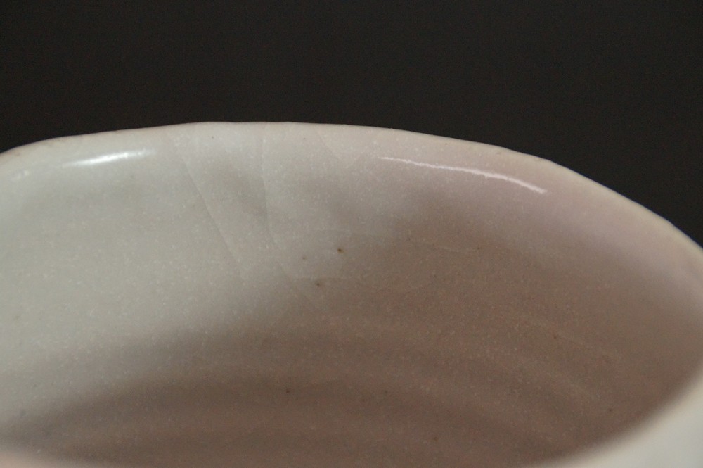 Close-up of the crackled glaze rim inside the chawan