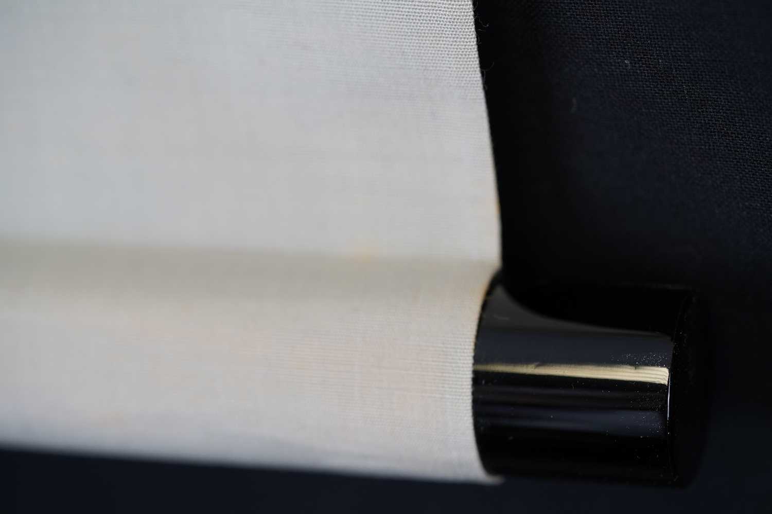 Detail View of the Black Lacquered Roller End of the Hanging Scroll Daruma in Ink