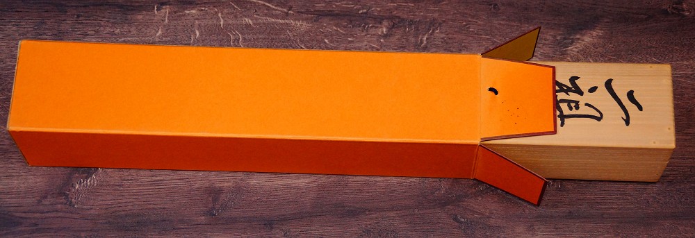 Close-up of the ink inscription on the orange storage box