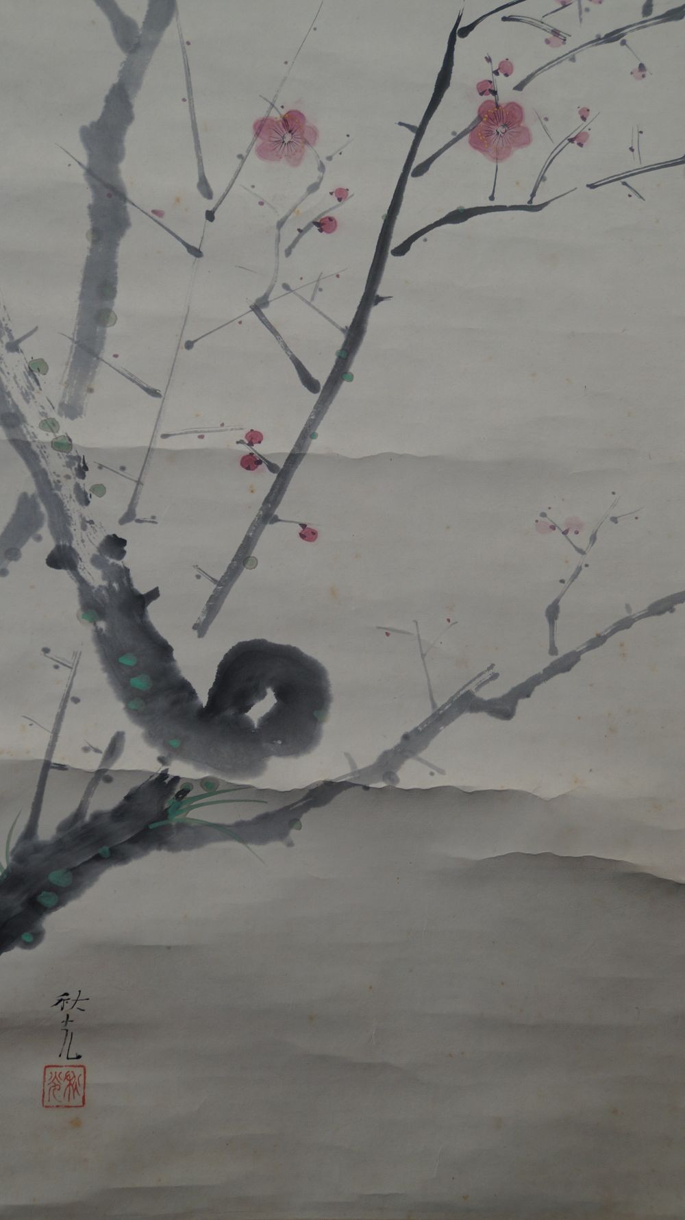 Detail view of the artist signature Yoshida Shuko and the red seal on the moss-covered trunk in the kakemono Nightingale on Blossoming Plum Branch