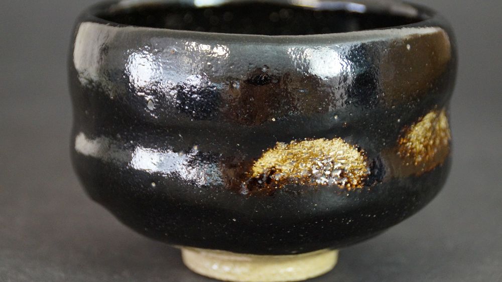 Additional view of the chawan made of Raku ware with iridescent black glaze surface