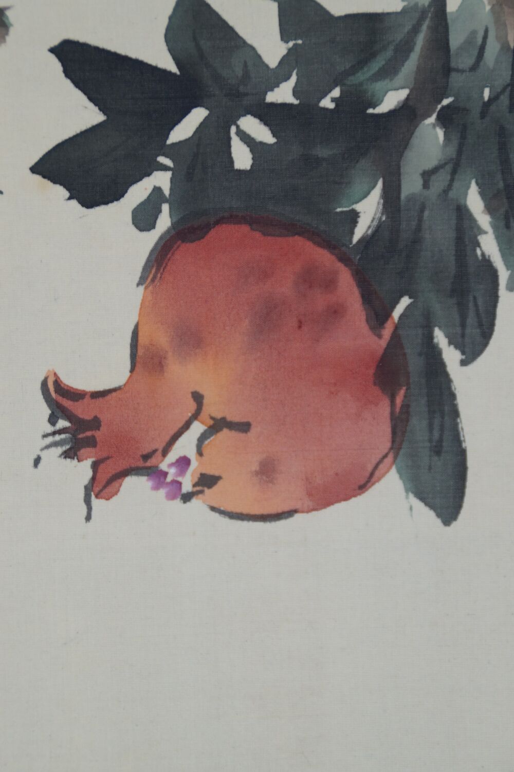 Additional close-up of a ripe pomegranate fruit with burst skin in the kakemono Pomegranate Branch and Starling