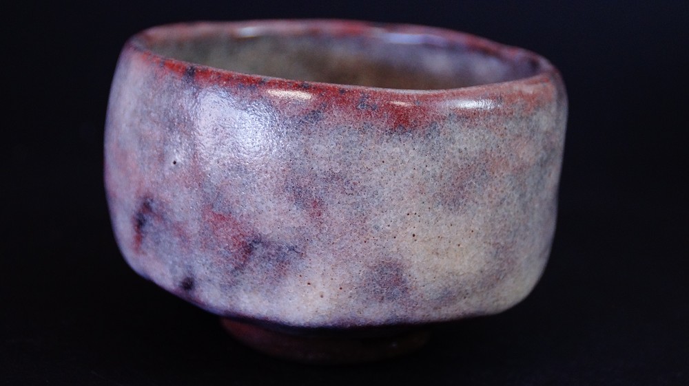 Another side view of the chawan made of Ohi ware with reddish-brown glaze by Kaihatsu Bunmei
