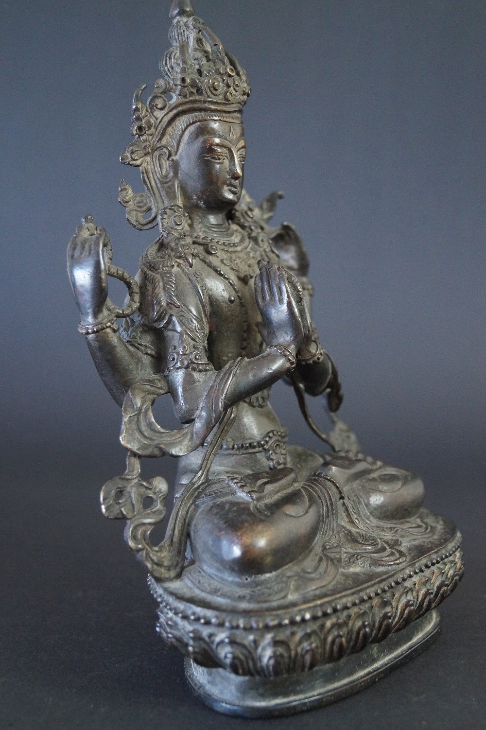 Nepalese Buddha figure made of bronze side view 2
