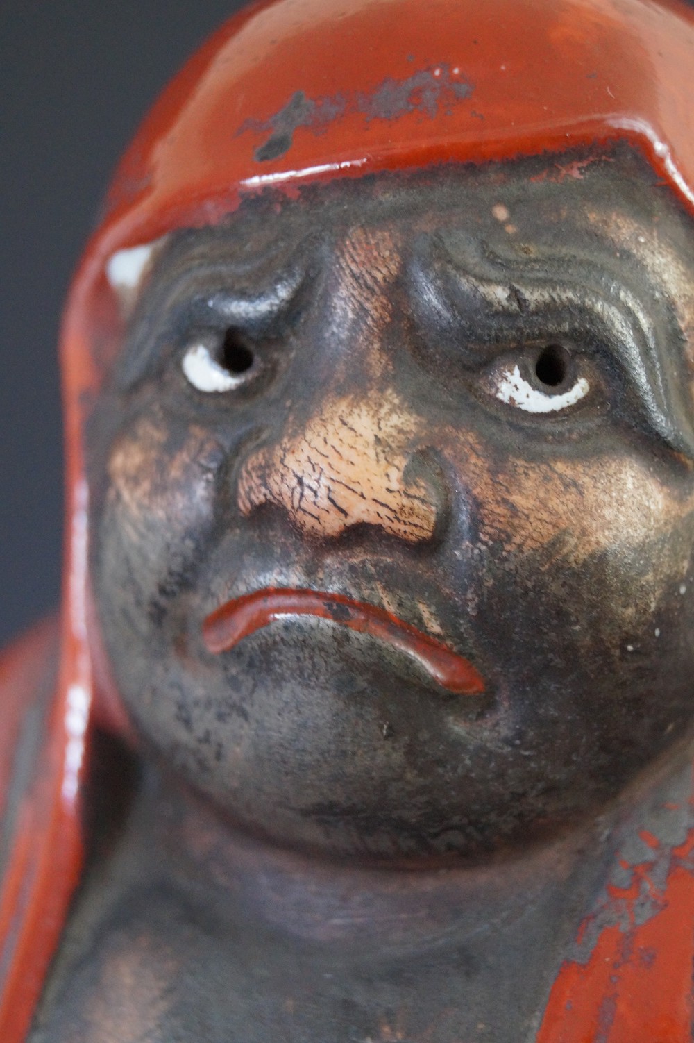 Bodhidharma Daruma figure made of Kutani porcelain face close-up 2
