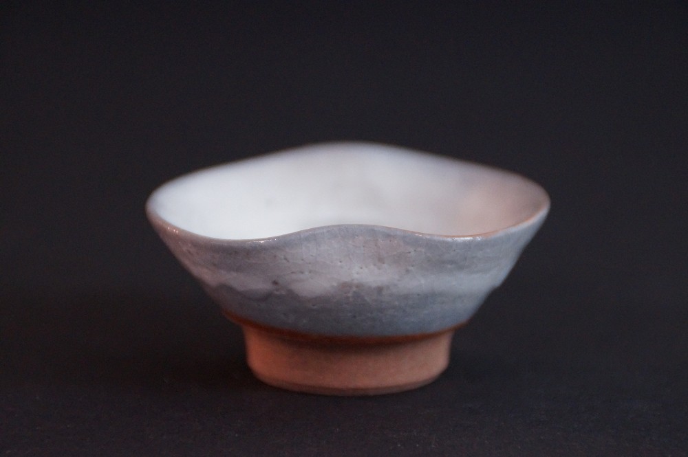 Back view of the guinomi with flowing color transitions in the glaze