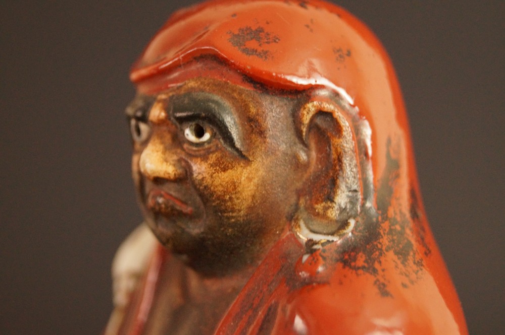 Bodhidharma Daruma Figure Made of Red Kutani Porcelain Close-Up of the Face in Three-Quarter Profile Face Close-Up 2