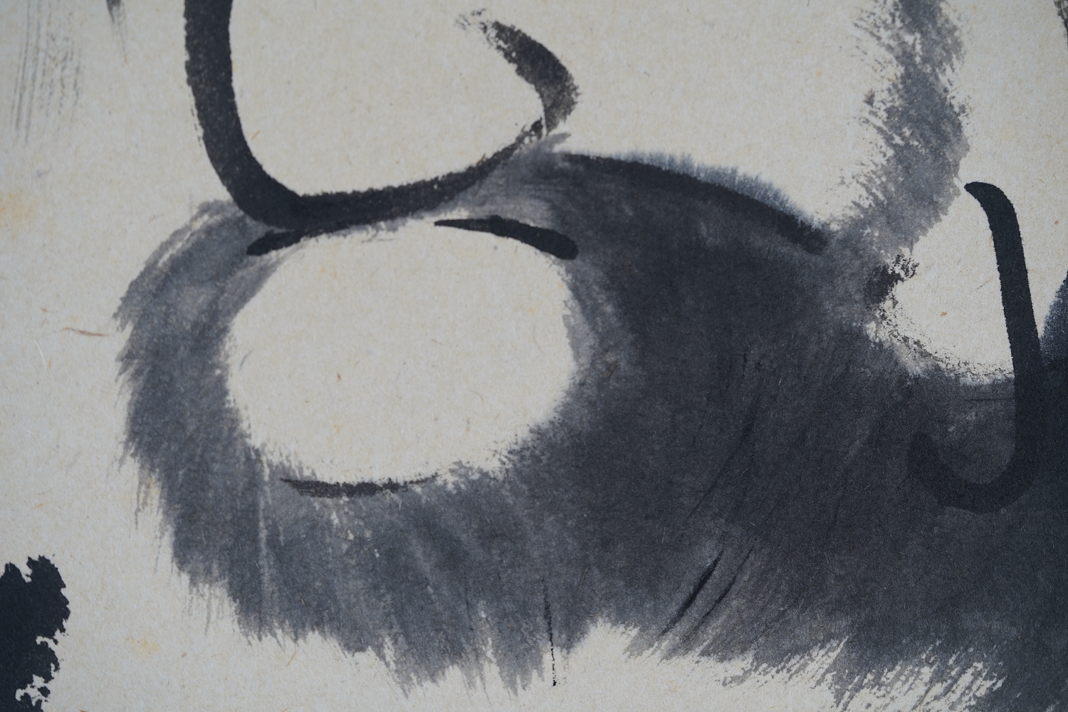 Close-up of the ink-painted Daruma face, eye area