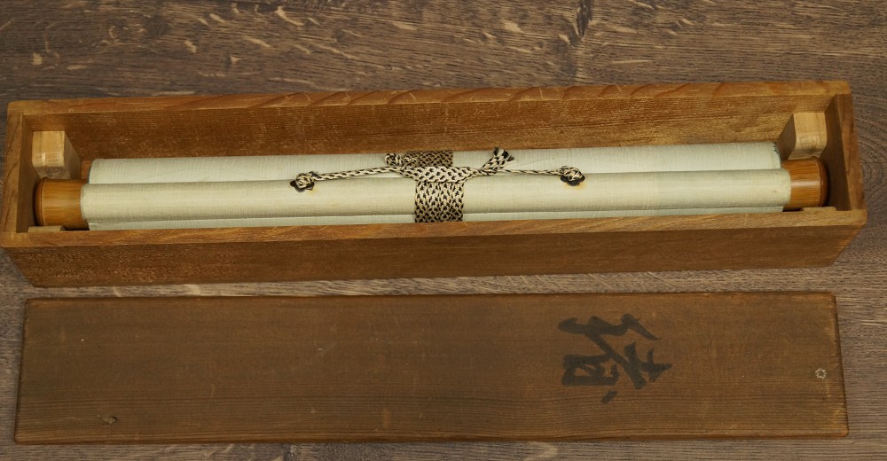 Rolled-Up Hanging Scroll in Opened Wooden Box with Cord