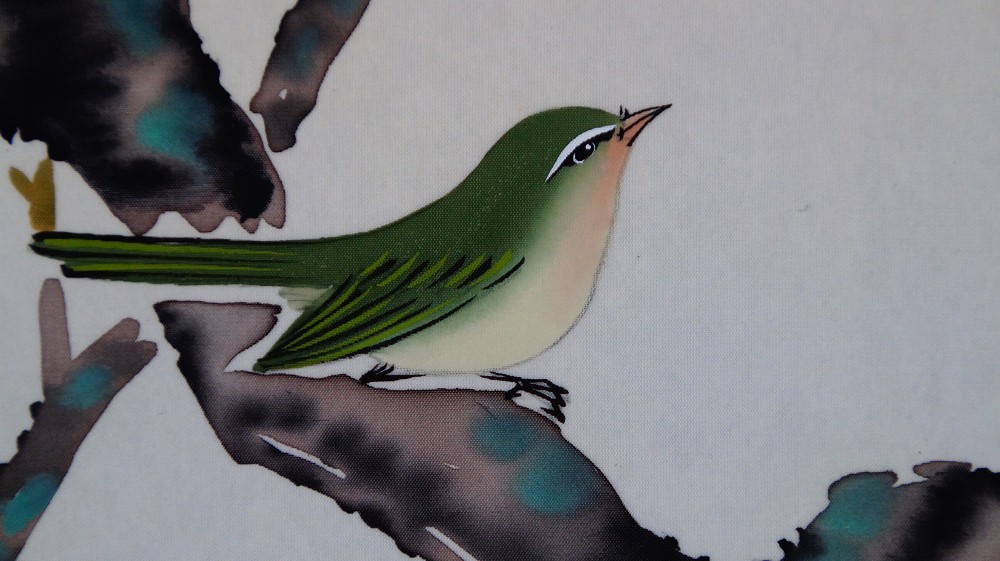 Extreme close-up of the first Japanese white-eye with green plumage on the plum branch in the hanging scroll Heralds of Spring by Koizumi Kogetsu