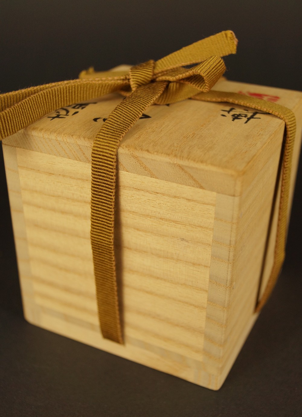 Closed storage box with golden cord Storage Box with Cord