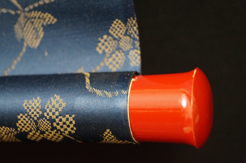 33 temples of the Saigoku pilgrimage close-up of the scroll roller end with red lacquer scroll roller detail
