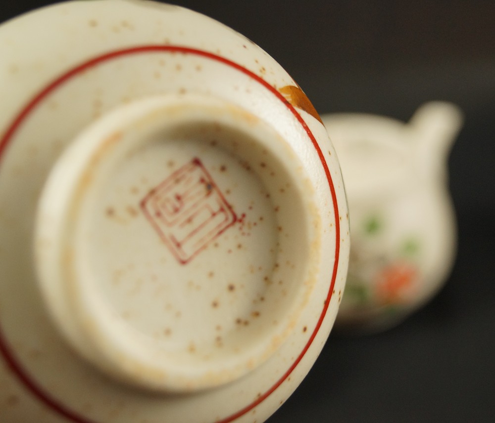 Tea set floral motif Imari porcelain base close-up
