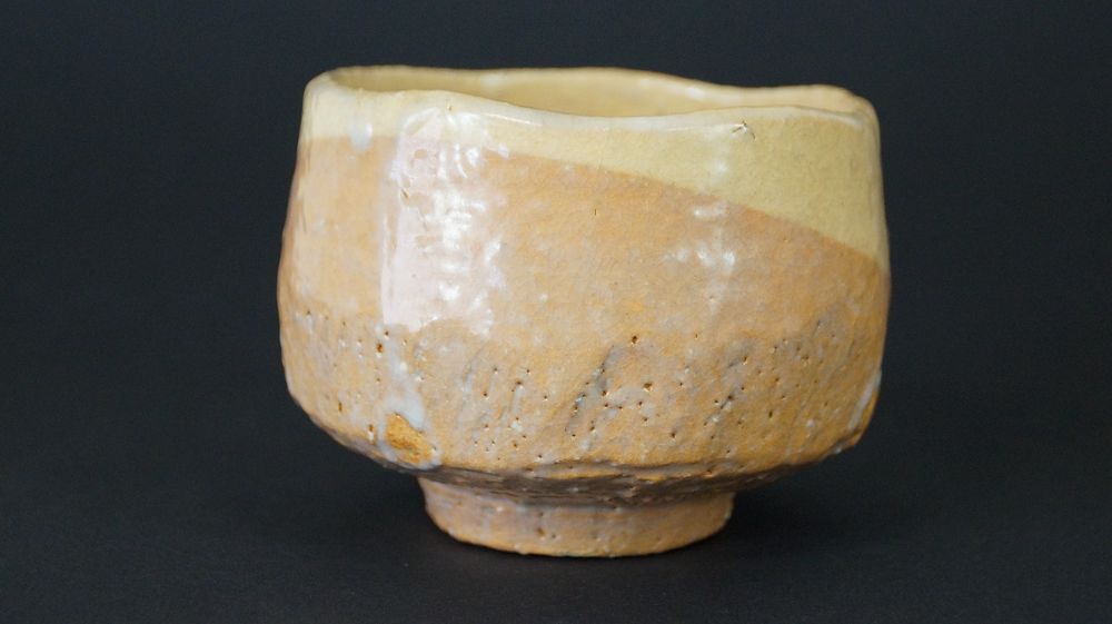 Further view of the chawan tea bowl made of Raku ware with diagonal glaze boundary