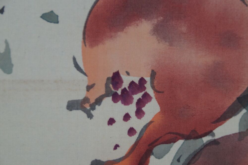 Macro shot of the visible pomegranate seeds in the hanging scroll Pomegranate Branch and Starling