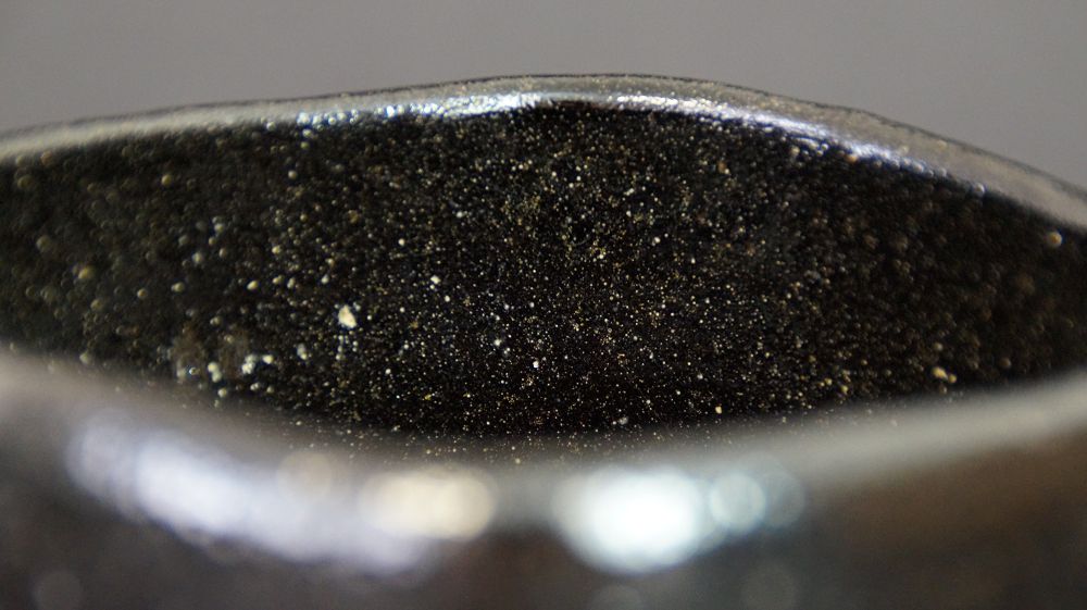 Close-Up of the Rim with Black, Gold-Speckled Interior Glaze of the Chawan Made of Raku Ware