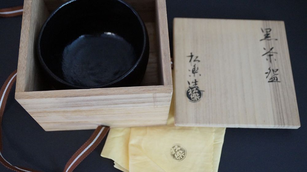 Chawan made of Raku ware in the opened storage box next to the signed box lid
