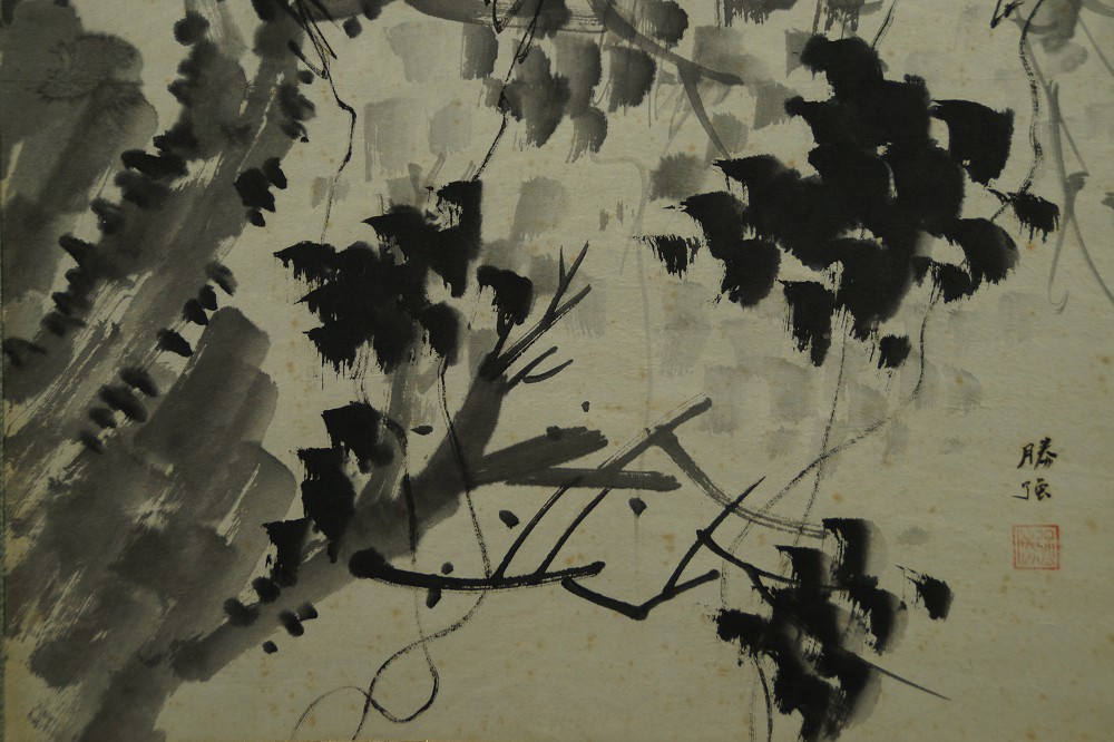 Close-up of the densely inked foliage with signature