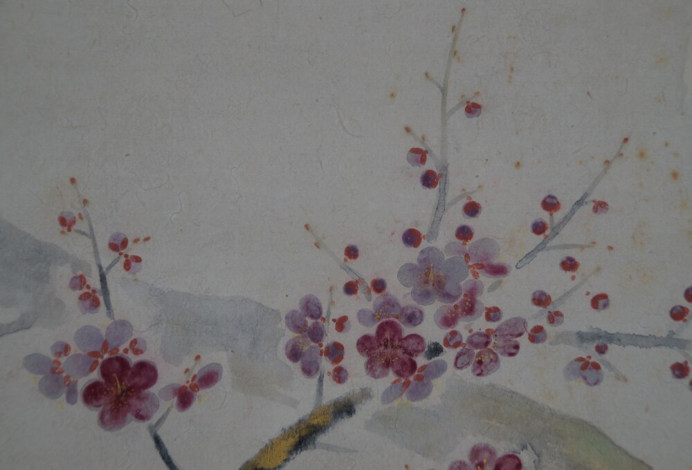 Close-up of the pink and purple blooming plum branch in the Kakemono Plum Blossoms in Quiet Dawn Light by Tokuoka Shinsen