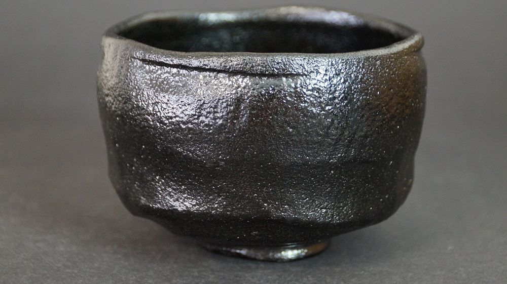 Further view of the chawan made of Raku ware with shimmering black glaze surface