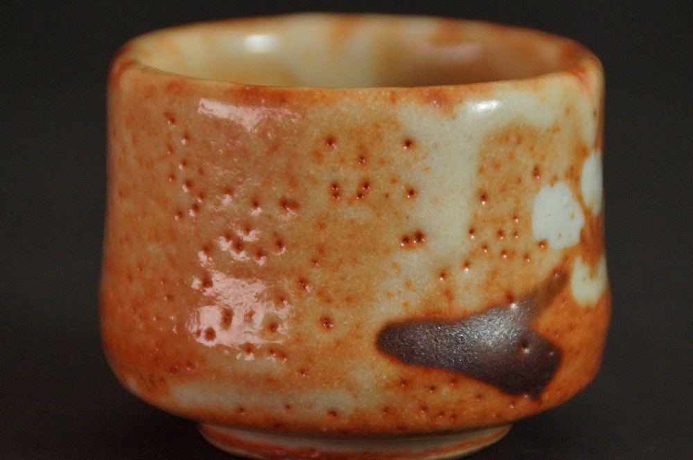 Further side view of the guinomi with dark brushstroke in the glaze