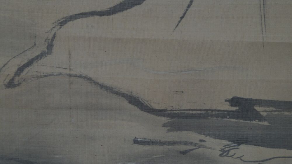 Close-up of the washed robe and feet of Bodhidharma in the kakemono Bodhidharma on the Way