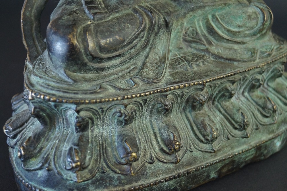 Chinese Buddha Figure Made of Bronze Base Close-Up 1
