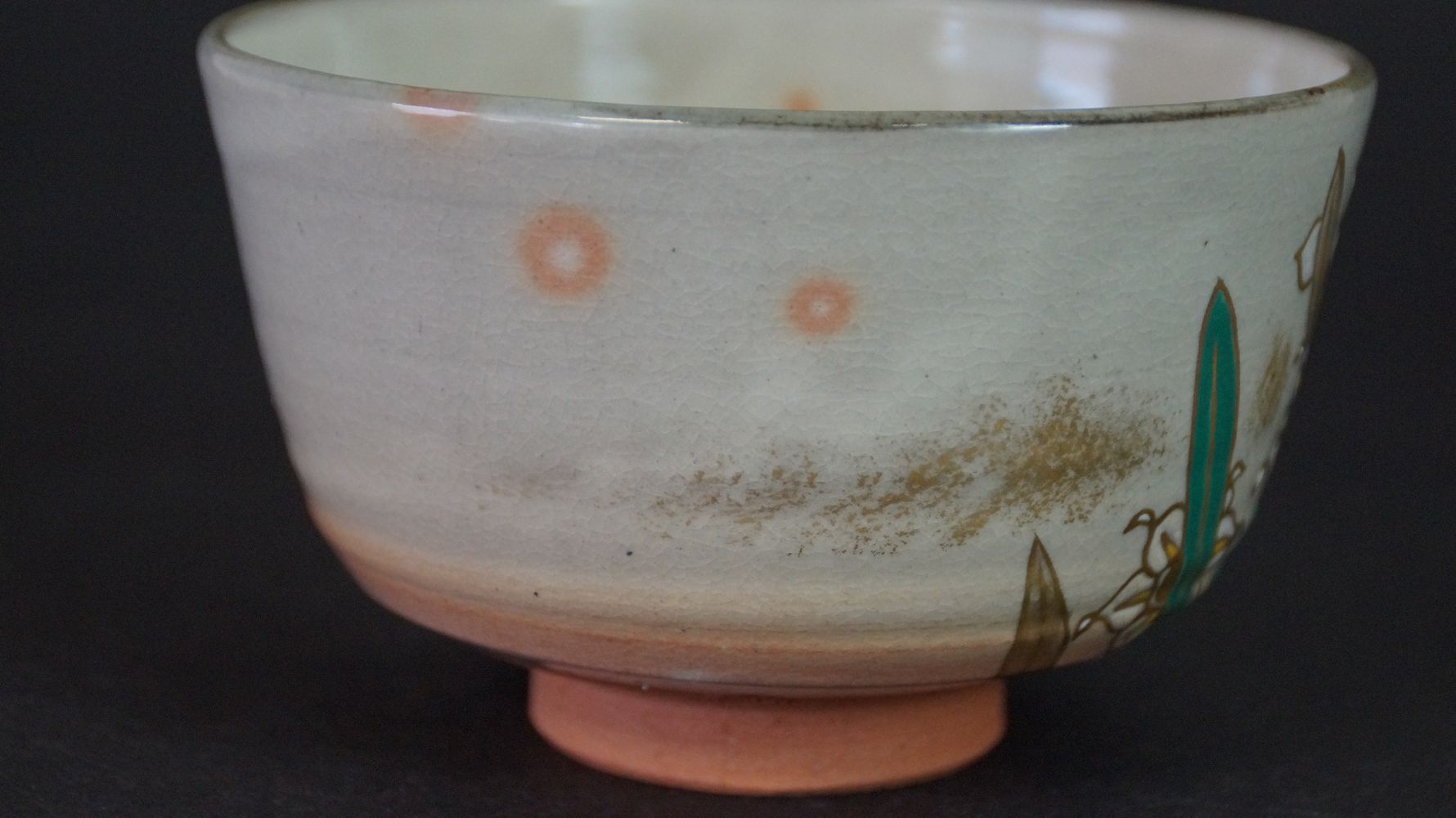 Additional view of the back of the chawan tea bowl made of Kyoto ware with orange dots