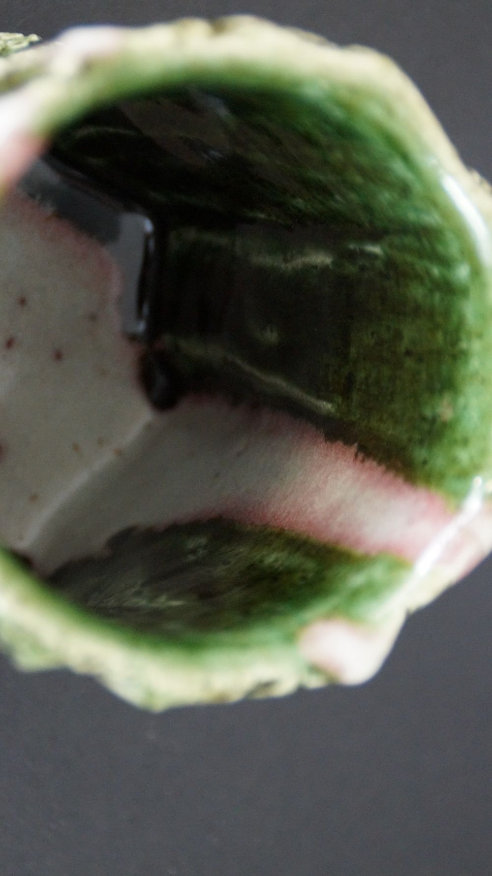 Another close-up of the green interior glaze with pink stripe of the yunomi tea bowl made of Oribe ware