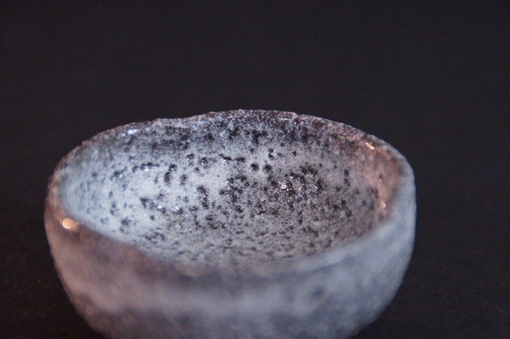 Close-up of the finely speckled Shino ware glaze interior