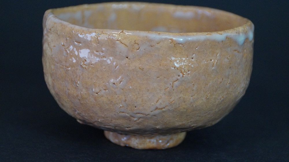 Another view of the chawan made of Hagi ware with drop-shaped glaze flow at the rim
