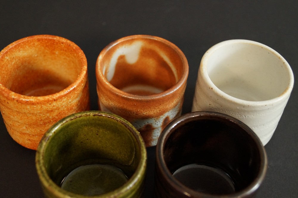 View from above into the five differently glazed sake cups set interior view