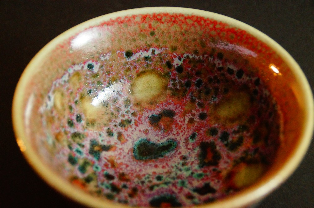 Close-up of the colorfully speckled glaze inside the Chawan