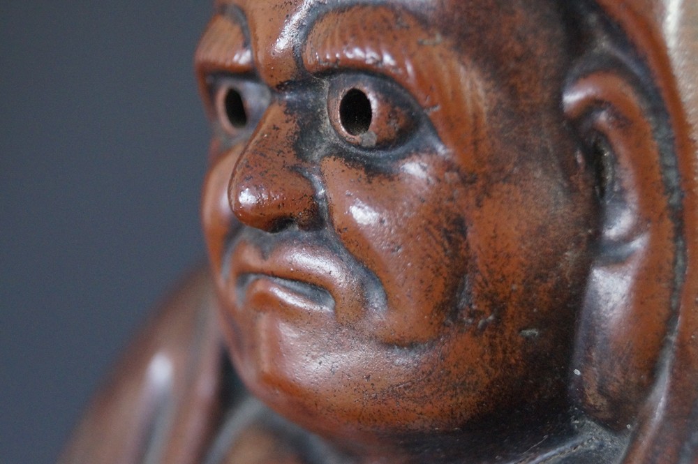 Daruma Figure Made of Bizen Ware Face Close-Up Profile