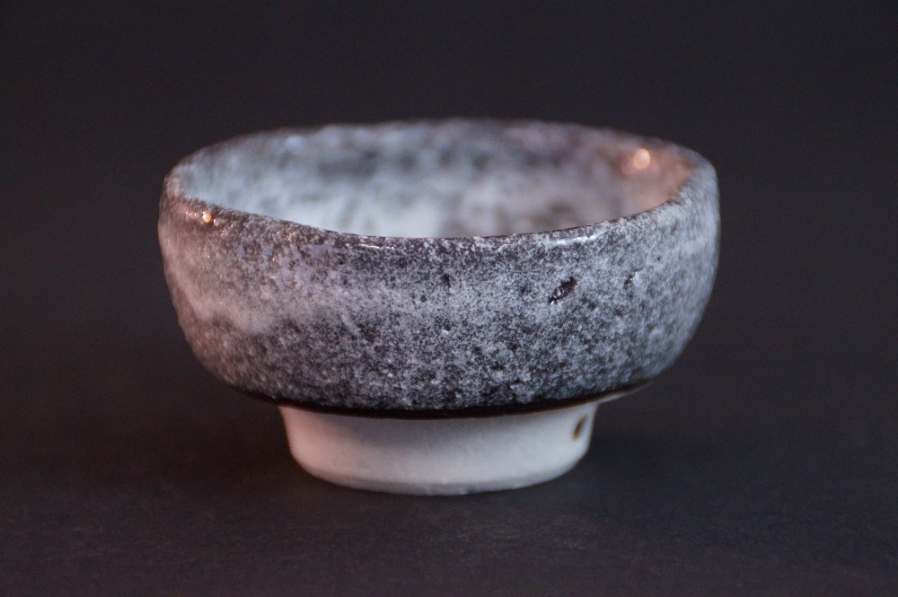 Back view of the guinomi with anthracite-colored speckled glaze