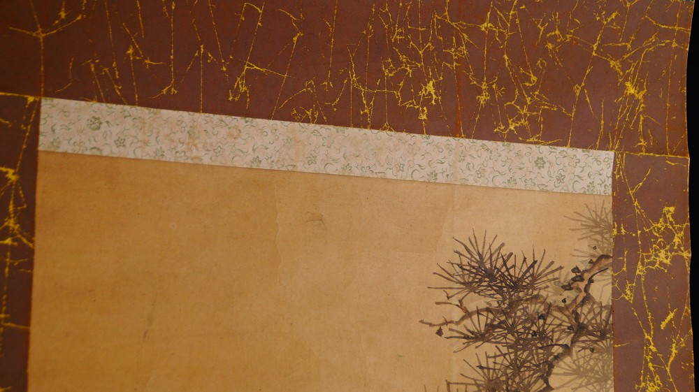 Detail of the upper mounting of the kakemono with light blossom damask and pine branch