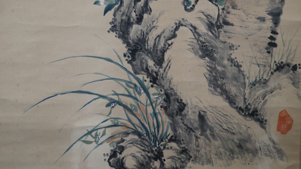 Close-up of the washed rock with blue orchid in the hanging scroll Spring Duet on Blossoming Branch