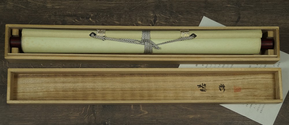 Rolled-up kakemono in the storage box with Kacho title label