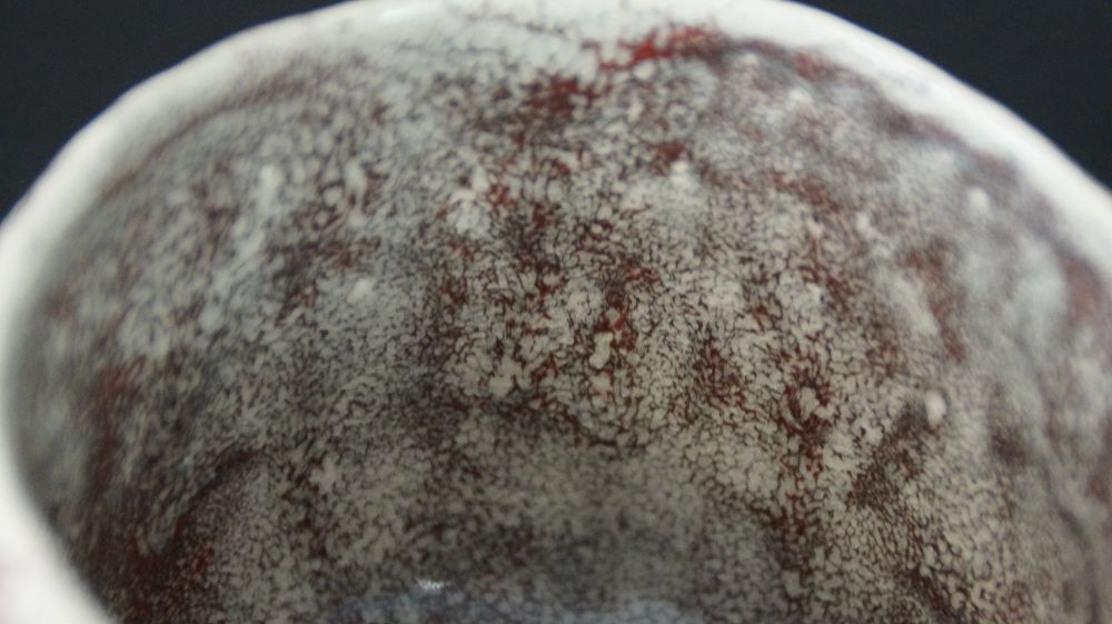 Close-up of the white-glazed rim of the Chawan tea bowl made of Minoh ware