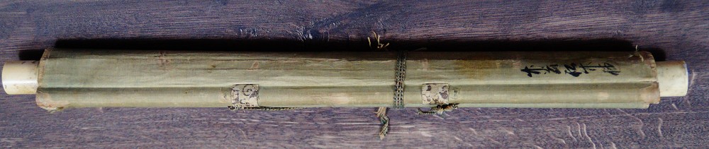 Rolled-up Kakemono with cord tie and two affixed labels