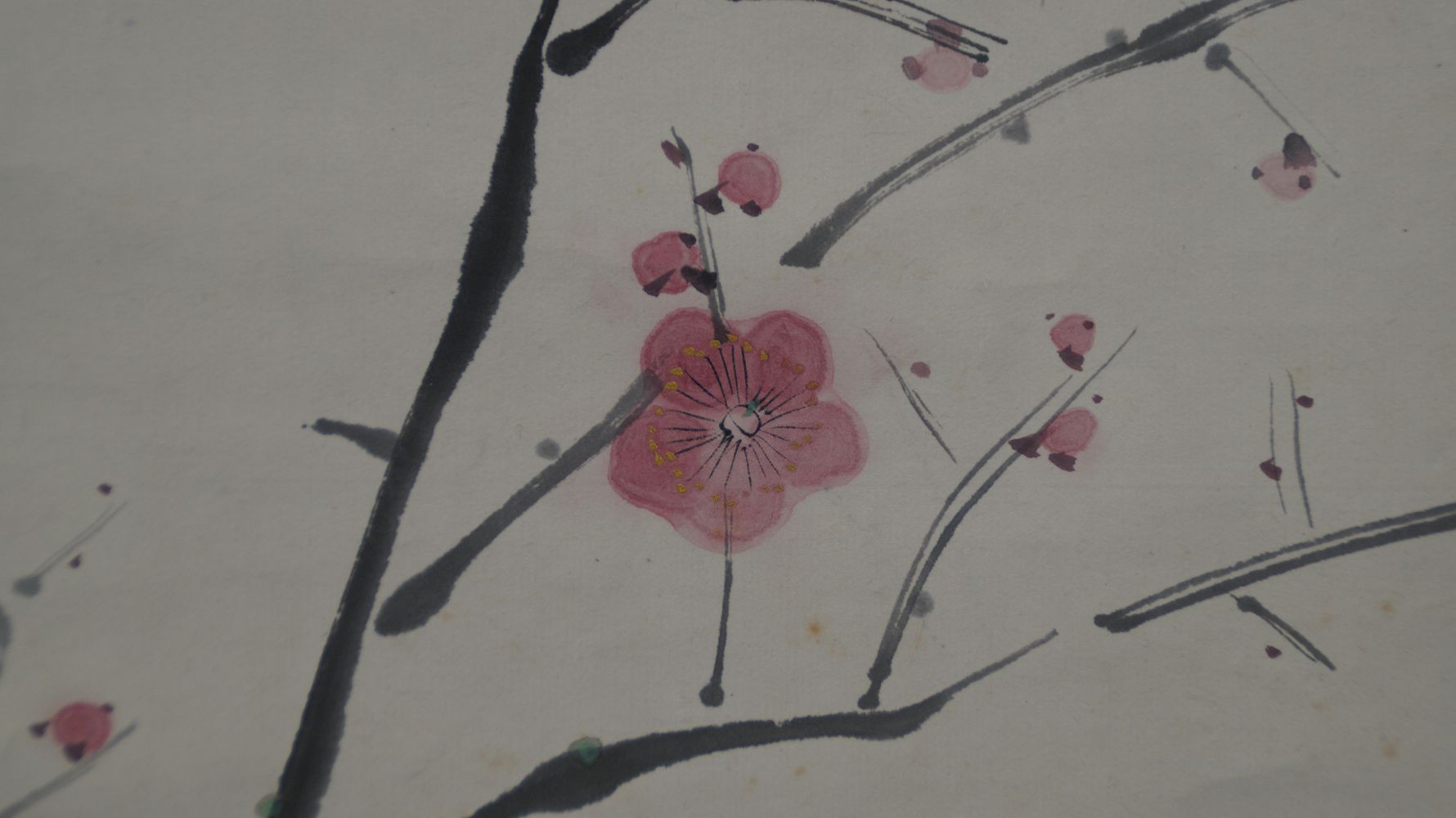 Extreme close-up of a single pink plum blossom in the kakemono Nightingale on Blossoming Plum Branch