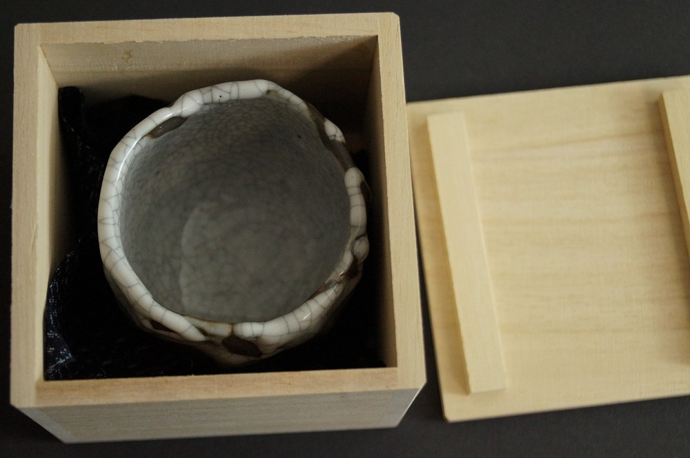 Sake Cup Lying in the Open Wooden Box with Dark Lining Guinomi in Storage Box